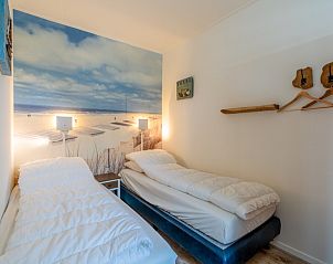 Attractive beach-themed bedroom in Apartment Anna 222, De Koog, Texel, perfect for a restful night's sleep.