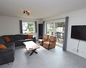 Gemtliches Wohnzimmer des Ferienhauses Stappeland 203 in De Koog Texel, mit bequemer Sitzecke.