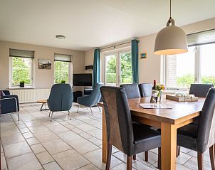 Dining area in Villa sleeps 6, De Koog, Texel. Enjoy meals overlooking the garden in this vacation home on the Wadden Islands.
