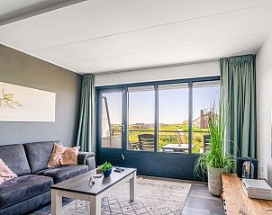 Comfortable sitting area in Apartment Juliana 094 Island and Sea View, De Koog, Texel with a view of nature.