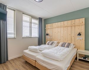 Attractive bedroom in Apartment Juliana 098 Eiland en Zeezicht, De Koog, Texel with double bed and natural light.