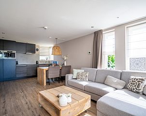 Open kitchen and living room in Apartment Juliana 034 Eilandzicht, De Koog, Texel with lots of natural light.