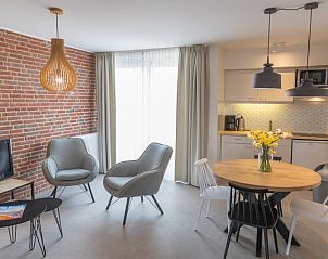 Spacious living room in Apartment 4 persons, De Koog, Texel with lots of daylight and modern furniture.