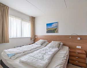 Attractive bedroom in Apartment Juliana 138, De Koog, Texel, with natural light.