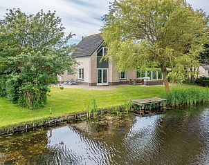 Vacation home Honeysuckle 47 in De Koog, Texel with beautiful waterfront garden for relaxation.