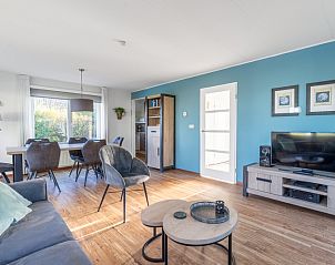 Cozy dining area in Holiday Home Honeysuckle 47, De Koog, Texel with lots of natural light.