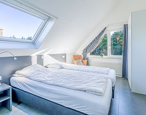 Bright bedroom with view in Holiday home Honeysuckle 93 with sauna, De Koog, Texel.