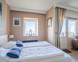 Komfortables Schlafzimmer mit Meerblick im Appartement Juliana 158 Zeezicht, Ferienhaus De Koog, Texel.