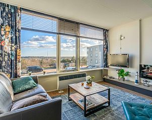 Bright living room of Apartment Juliana 126 Eilandzicht, De Koog, Texel with views of nature and sea.