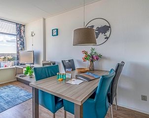 Dining table with a view in Apartment Juliana 126 Eilandzicht, De Koog, Texel, ideal for cozy dinners.