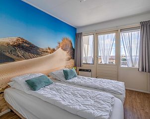 Bedroom with dune motif in Apartment Juliana 126 Eilandzicht, De Koog, Texel for a restful night's sleep.