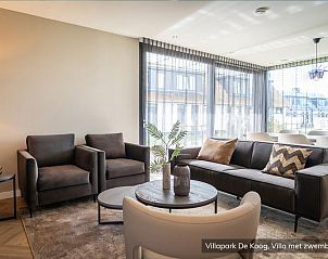 Luxury family villa with pool in De Koog, Texel. Cozy sitting area with modern decor in the Wadden Islands.