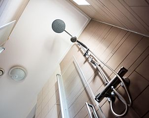 Modern shower in Villa 8, De Koog, Texel, offers luxury and comfort in this beautiful vacation home.