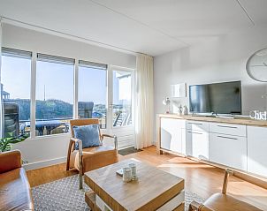 Gemtliches Wohnzimmer im Appartement Juliana 052 Insel- und Meerblick, De Koog, Texel mit schner Aussicht auf die Dnen.