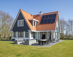 Villa 8 in De Koog, Texel, offers a spacious vacation home with sunny terrace and green garden, ideal for a relaxing stay on the Wadden Islands.