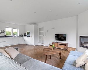 Open kitchen and living room at Stappeland 197, vacation home De Koog, Texel with modern amenities.