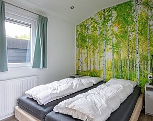 Attractive bedroom in Chalet Bregkoog 12, De Koog, Texel with a soothing forest theme on the Wadden Islands.