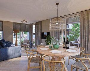 Cozy dining area in Duinvilla Wellness 4, vacation home in De Koog, Texel with wooden table and chairs.