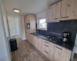 Fully equipped kitchen in Chaletpark Bregkoog - Chalet 240 De Texelse Berg, De Koog, Texel with modern appliances.