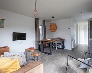 Dining area and lounge in Chalet Bregkoog 36, Chaletpark Bregkoog, De Koog, Texel.