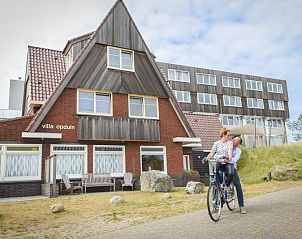 Exterior of Grand Hotel Opduin - Holiday Apartment A in De Koog, Texel, surrounded by nature and tranquility on the Wadden Islands.