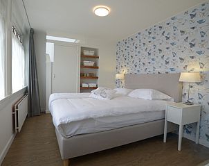 Comfortable bedroom in Grand Hotel Opduin - Holiday home A, De Koog, Texel with elegant design on the Wadden Islands.