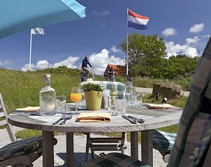 Relaxing terrace at Grand Hotel Opduin - Vakantiewoning A, De Koog, Texel overlooking the nature of the Wadden Islands.