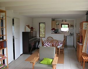 Cozy indoor area of Bungalow Oud Vredelust 75 in De Koog, Texel with dining area.