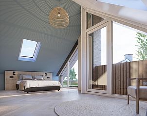Spacious bedroom in Duinvilla Wellness 6, Texel, with large bed and lots of natural light.