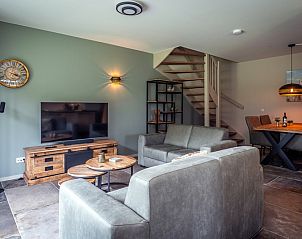 Bright living room of Holiday home in De Koog, Texel, with access to the garden.
