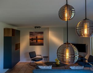 Stylish lighting in the living room of Zilte Bries vacation home in De Koog, Texel.