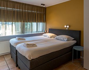 Comfortable bedroom in Zilte Bries vacation home in De Koog, Texel with double bed.