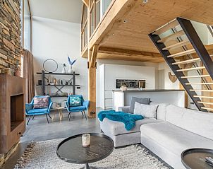 Stylish living room with open kitchen in Holiday home in De Koog Texel, ideal for a relaxing vacation on the Wadden Islands.