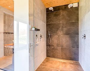 Spacious shower with modern finishes in Holiday home in De Koog Texel, offers luxury on the Wadden Islands.