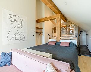 Stylish bedroom with art on the wall in Holiday home in De Koog Texel, for an artistic stay on the Wadden Islands.