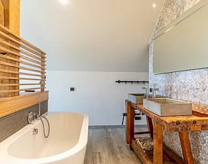 Modern bathroom with freestanding bathtub in Holiday home in De Koog Texel, for a luxury experience on the Wadden Islands.