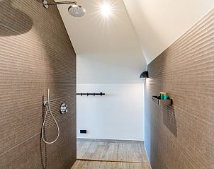 Walk-in shower with stylish tiles in Holiday home in De Koog Texel, offers comfort on the Wadden Islands.
