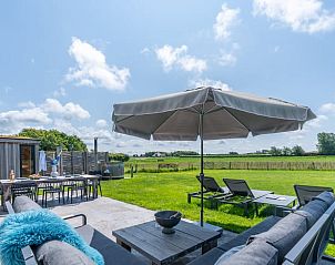 Terrace with comfortable seating and views of nature in Holiday home in De Koog Texel, for relaxation on the Wadden Islands.