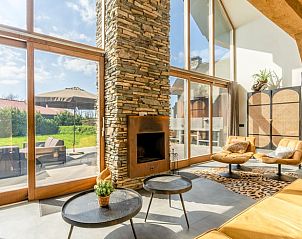 Cozy living room with fireplace in Holiday home in De Koog, Texel.