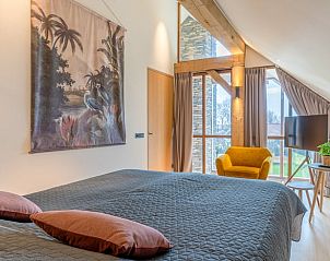 Comfortable bedroom overlooking the garden in Holiday home in De Koog, Texel.