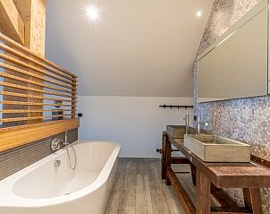 Luxury bathroom with freestanding bathtub in Holiday home in De Koog, Texel.