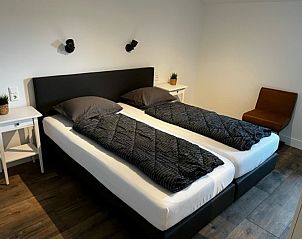 Attractive bedroom in Bungalow 2, De Koog, Texel, with comfortable beds and restful furnishings.