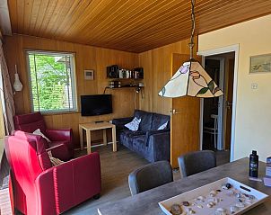 Cozy living room in Bungalowpark De Nagtegaal - Bungalow 47, Texel, with comfortable seating.