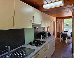 Spacious kitchen with appliances in Bungalowpark De Nagtegaal - Bungalow 47, Texel, Wadden Islands.