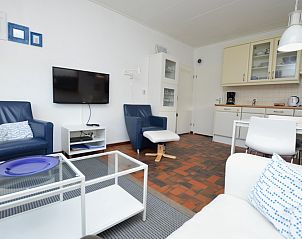 Offener Wohn- und Essbereich im Ferienhaus Orchismient 18 small, De Koog Texel mit stilvoller Einrichtung.