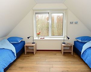 Gemtliches Kinderzimmer in Duinrand Holiday Villas Typ 1 in De Koog Texel mit zwei Betten.