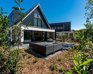 Terrace of cottage in Den Burg, Texel, with comfortable seating.