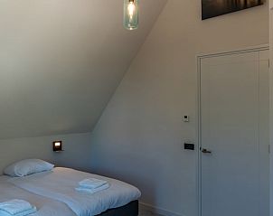 Bathroom of Holiday Home in Den Burg, Texel, with modern shower and sink.