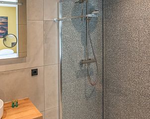 Stylish bathroom in Holiday home in Den Burg, Texel, with sink and toilet.