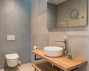 Compact toilet with tiling in Holiday home in Den Burg, Texel.